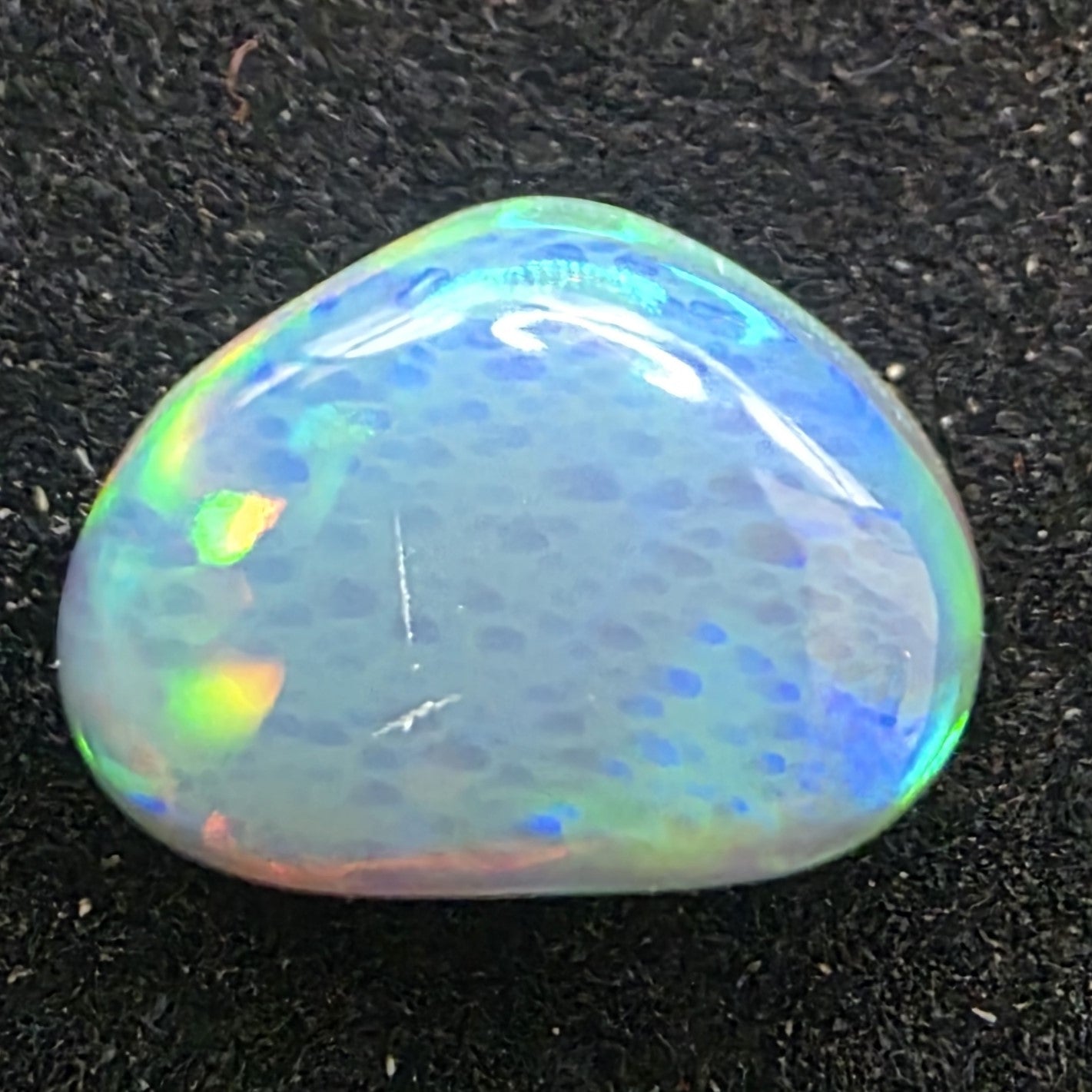 Black Opal special Ethiopian Welo, 4.25 ct freeform polished, natural, intense Play-of-Colour