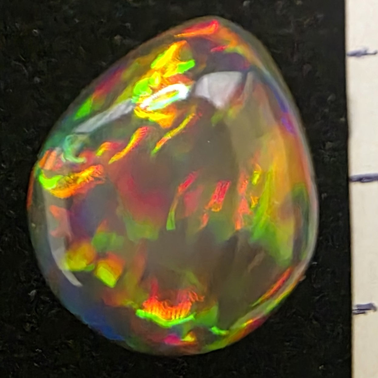 Black Opal special Ethiopian Welo, 3.7 ct pear polished, natural, intense Play-of-Colour