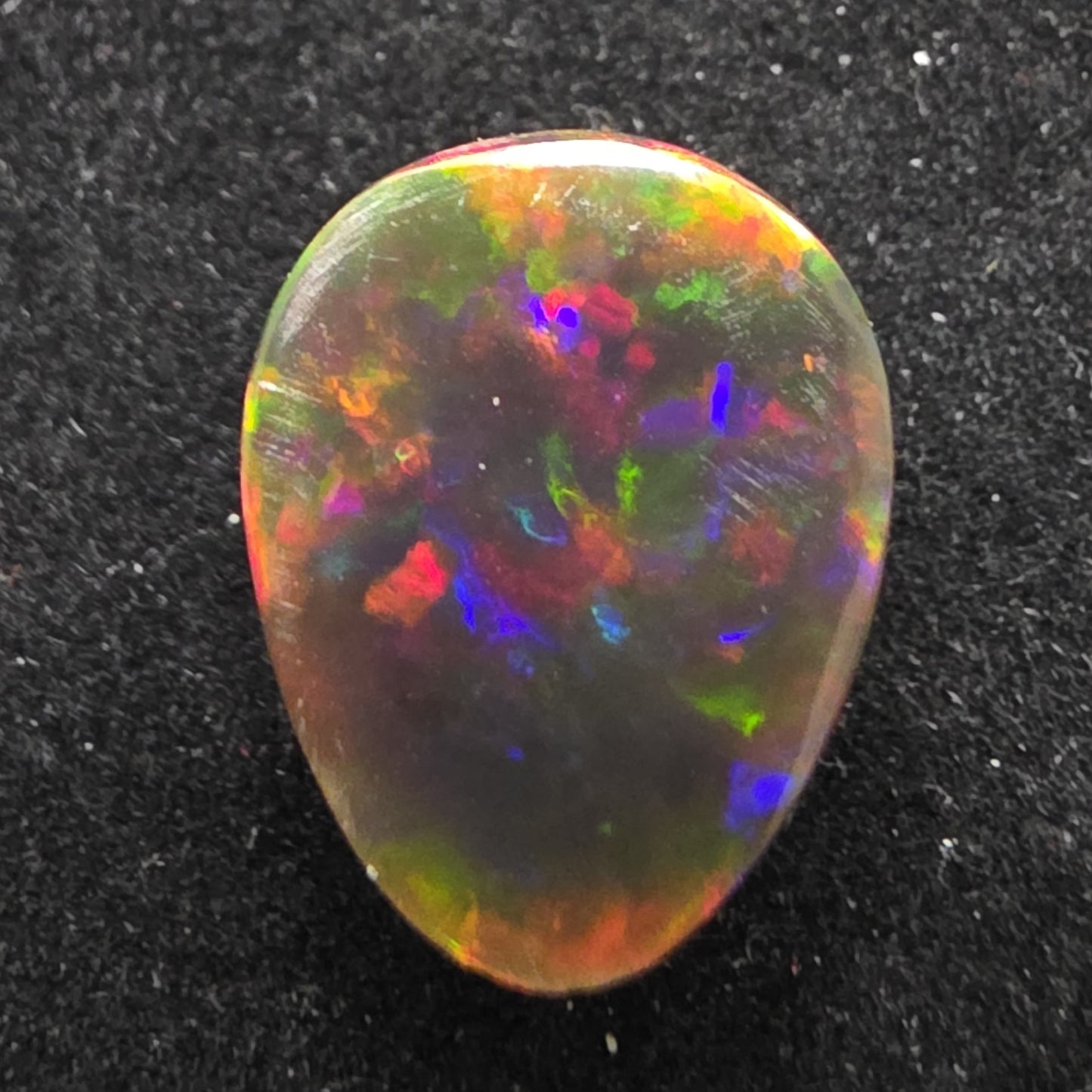 Black Opal special Ethiopian Welo, 4.7 ct pear polished, natural, intense Play-of-Colour