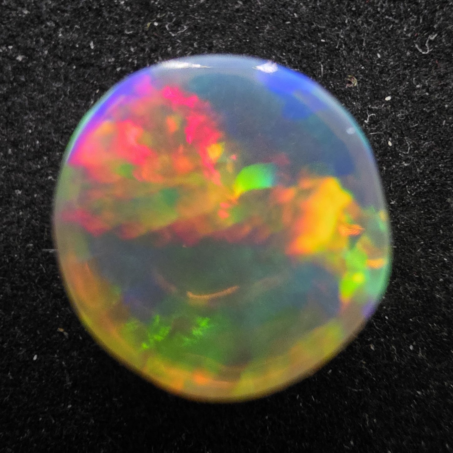 Crystal Opal special Ethiopian Welo, 5.6 ct round polished, natural, intense Play-of-Colour