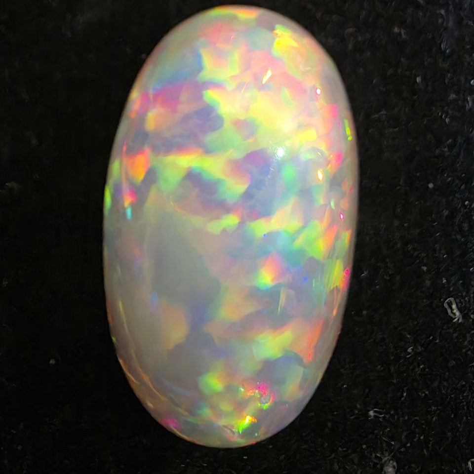 White Opal special Ethiopian Welo, 11.55 ct oval polished, natural, intense Play-of-Colour