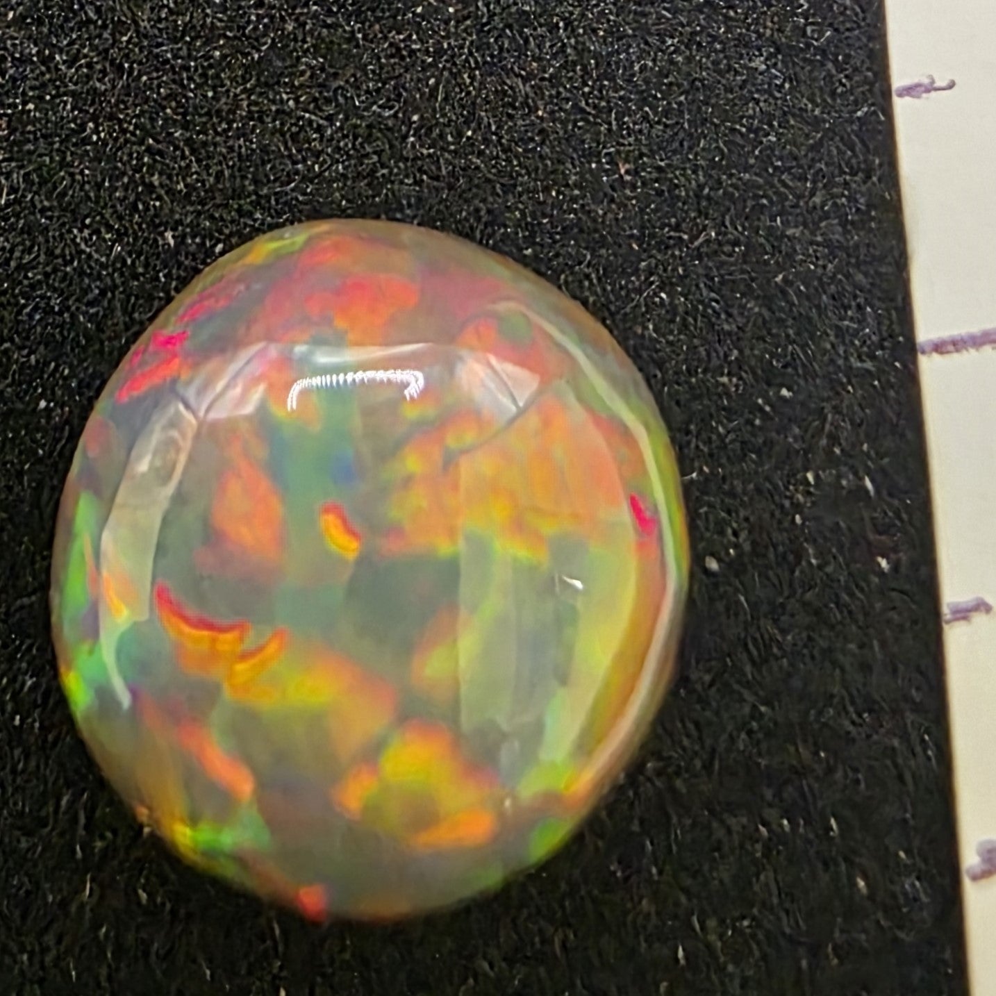 Black Opal special Ethiopian Welo, 4.4 ct freeform polished, natural, intense Play-of-Colour