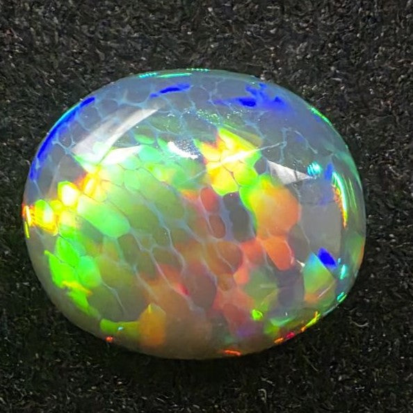 Black Opal special Ethiopian Welo, 6.65 ct oval polished, natural, intense Play-of-Colour