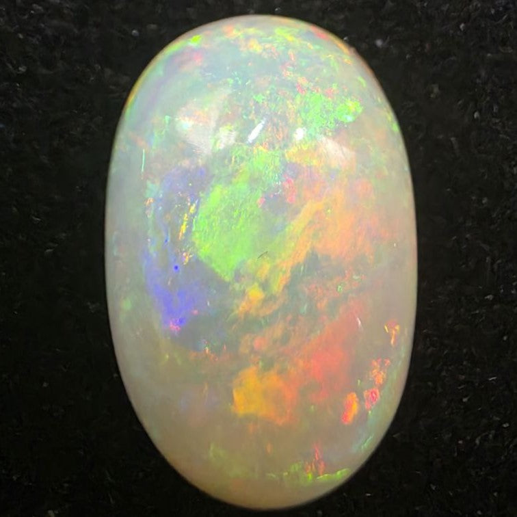 White Opal special Ethiopian Welo, 5.8 ct oval polished, natural, intense Play-of-Colour