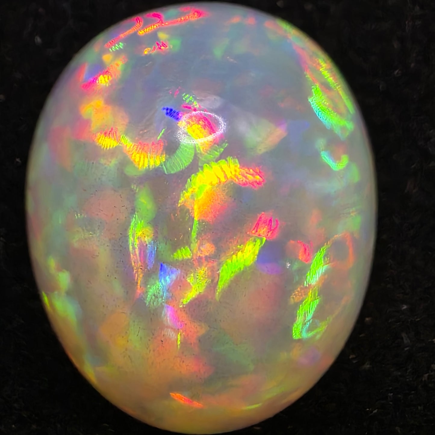 White Opal special Ethiopian Welo, 10.45 ct freeform polished, natural, intense Play-of-Colour
