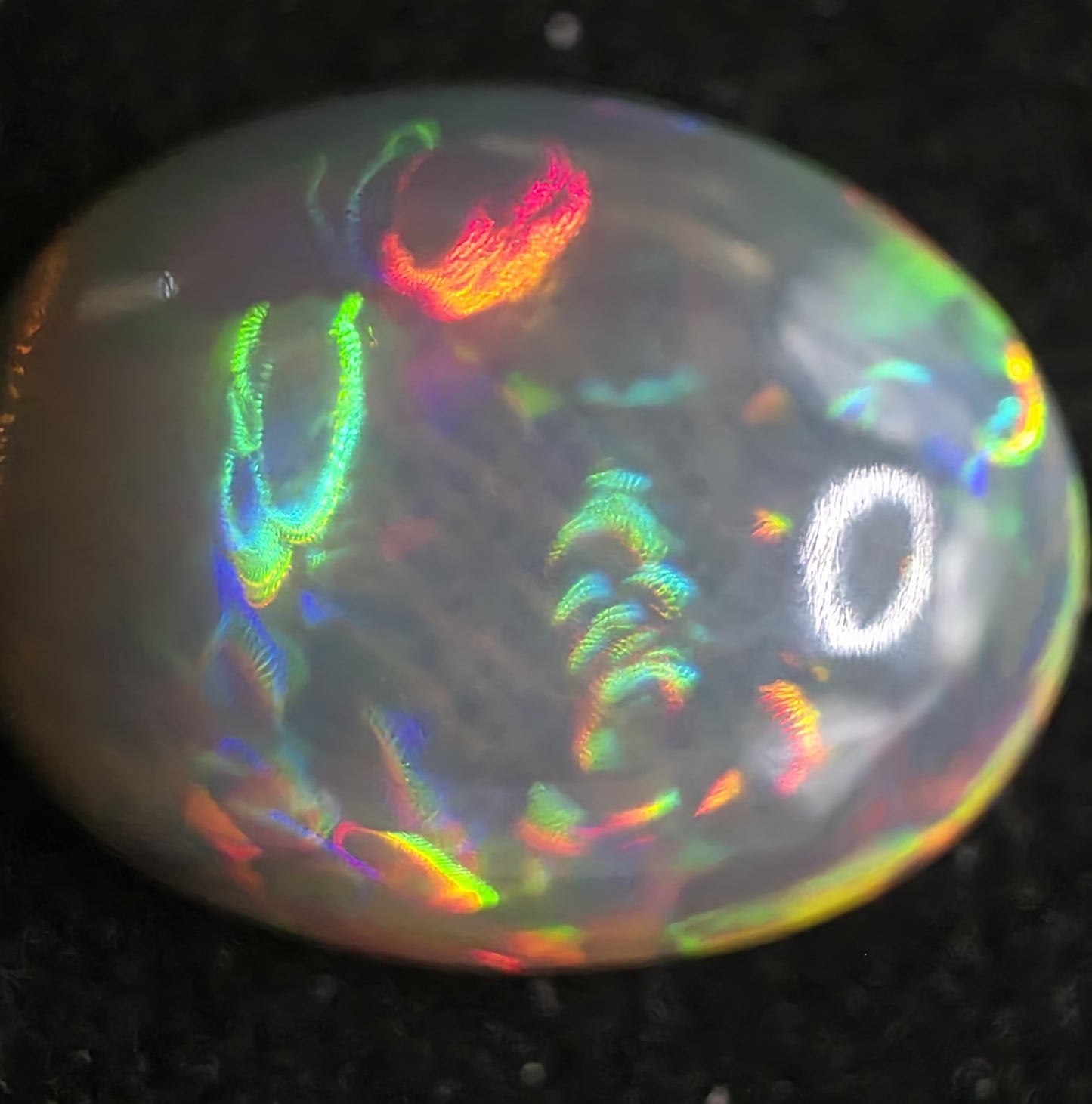 Black Opal special Ethiopian Welo, 7.45 ct oval polished, natural, intense Play-of-Colour