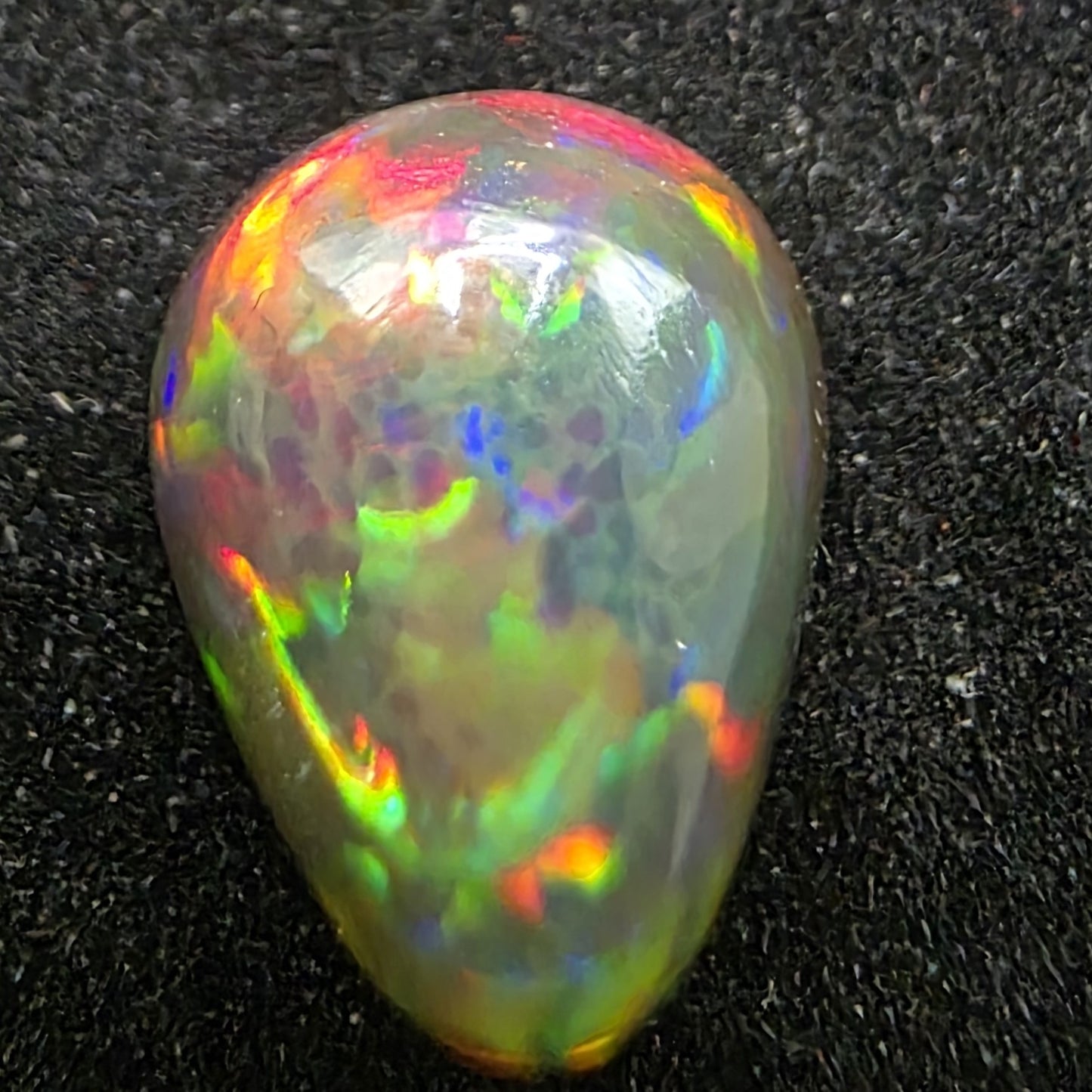 Black Opal special Ethiopian Welo, 5 ct pear polished, natural, intense Play-of-Colour