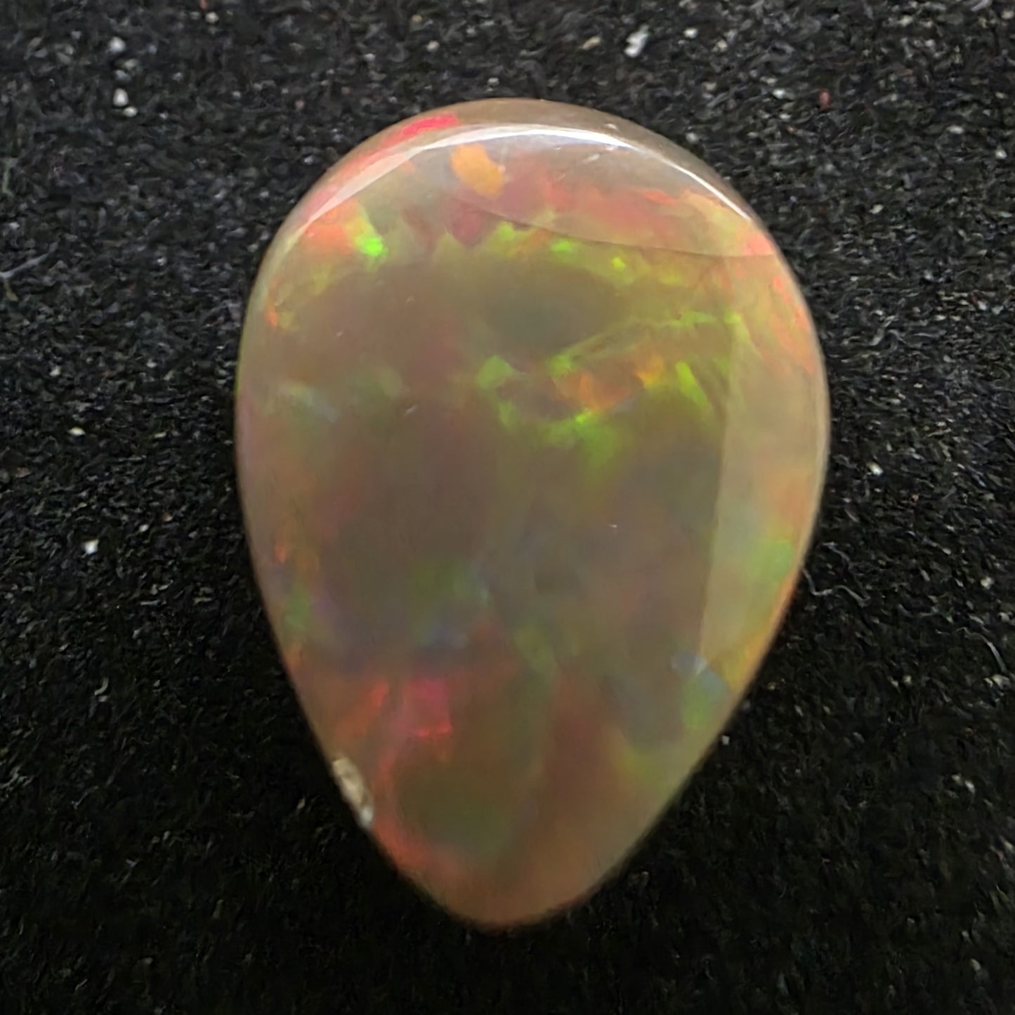 Black Opal special Ethiopian Welo, 7.2 ct pear polished, natural, intense Play-of-Colour