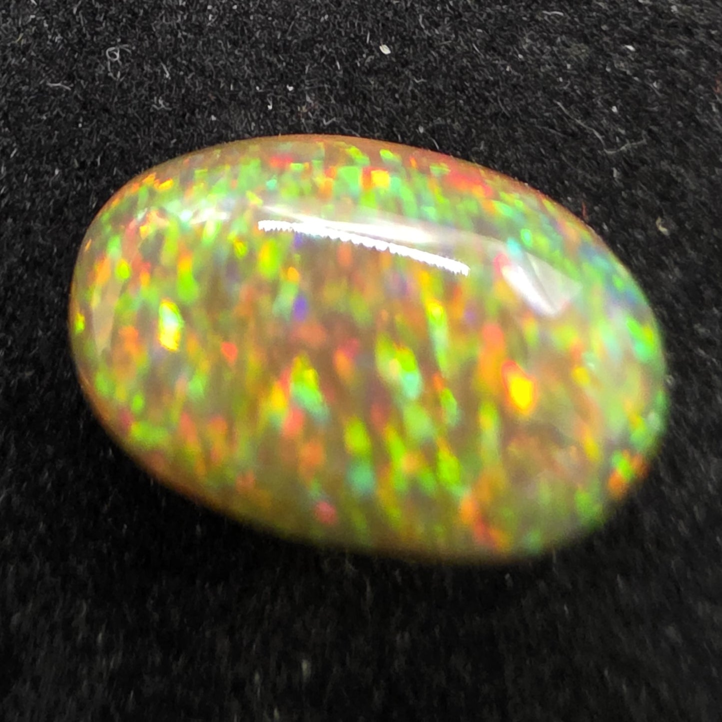 Black Opal special Ethiopian Welo, 4.1 ct oval polished, natural, intense Play-of-Colour