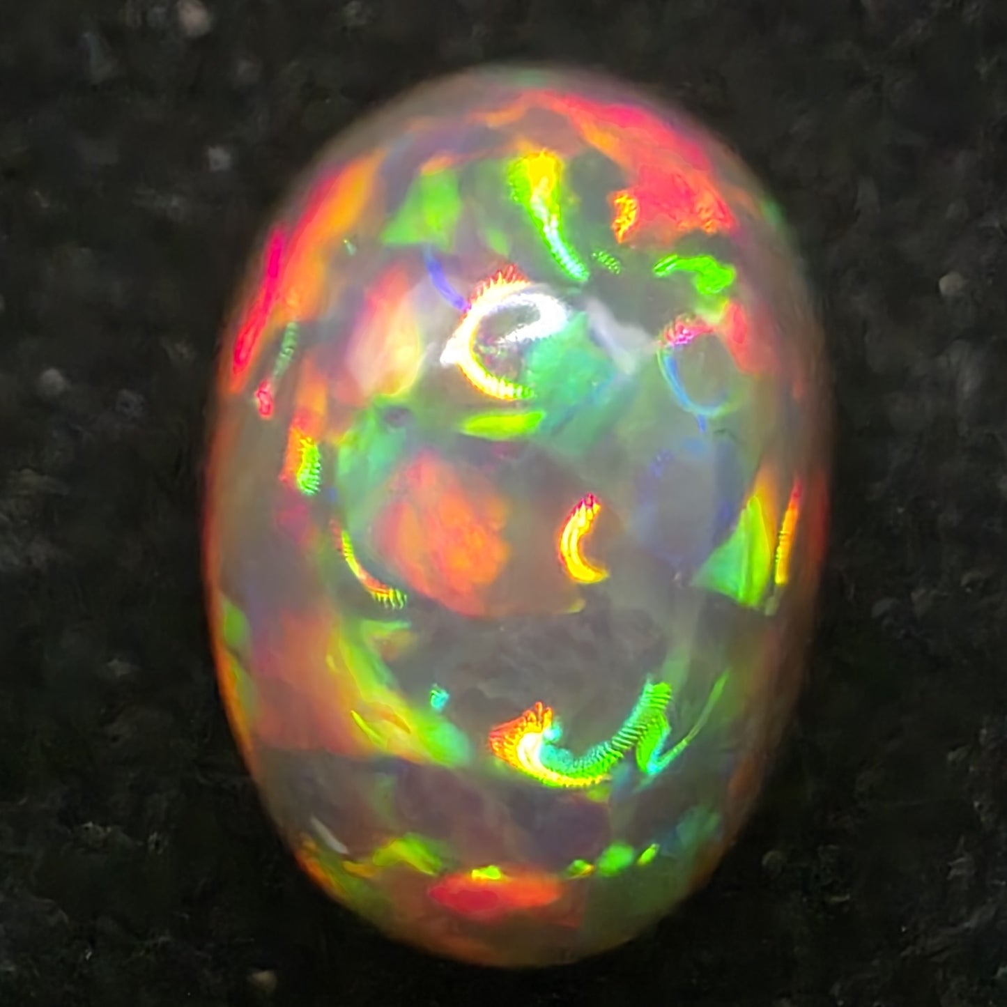 Black Opal special Ethiopian Welo, 6.05 ct oval polished, natural, intense Play-of-Colour