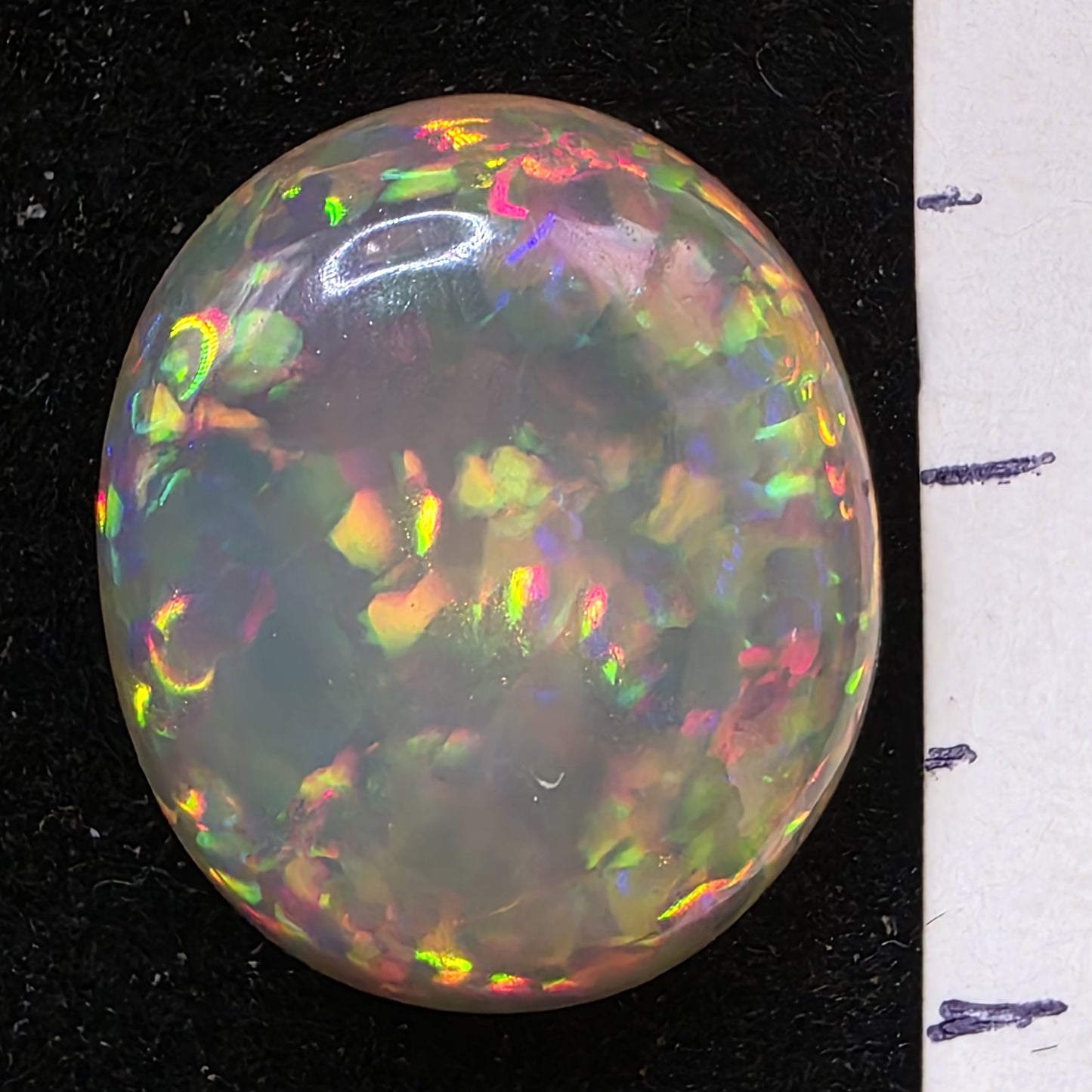 Black Opal special Ethiopian Welo, 6.65 ct oval polished, natural, intense Play-of-Colour