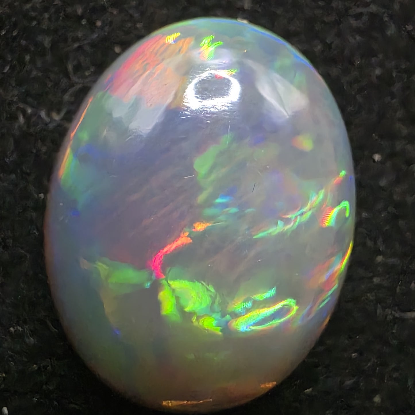 Black Opal special Ethiopian Welo, 7.45 ct oval polished, natural, intense Play-of-Colour