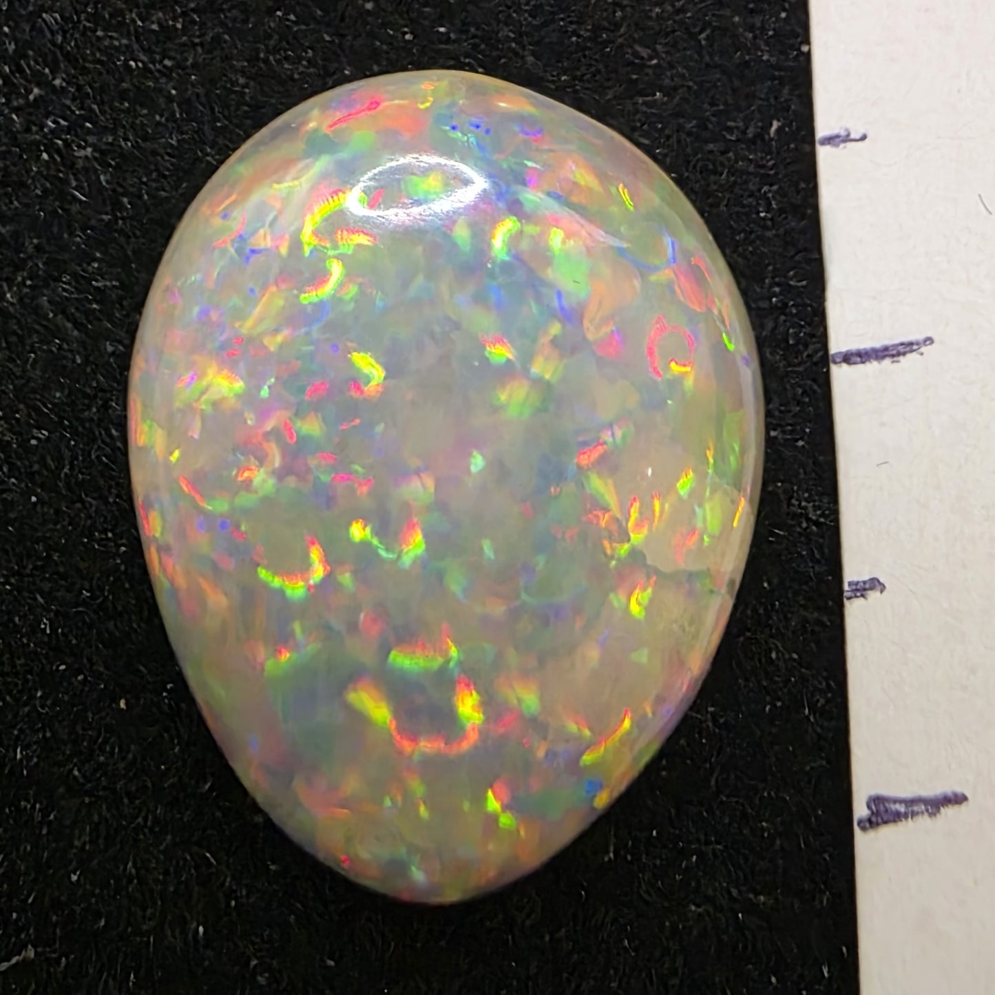 White Opal special Ethiopian Welo, 6.85 ct oval polished, natural, intense Play-of-Colour