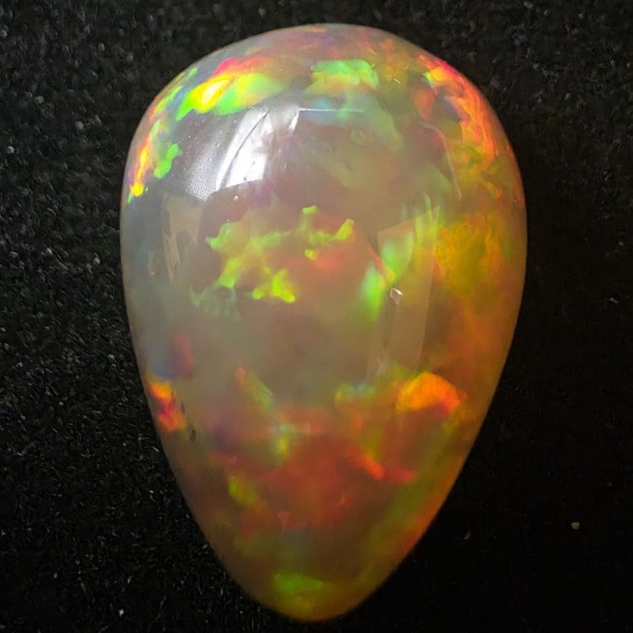 Black Opal special Ethiopian Welo, 23.55 ct pear polished, natural, intense Play-of-Colour