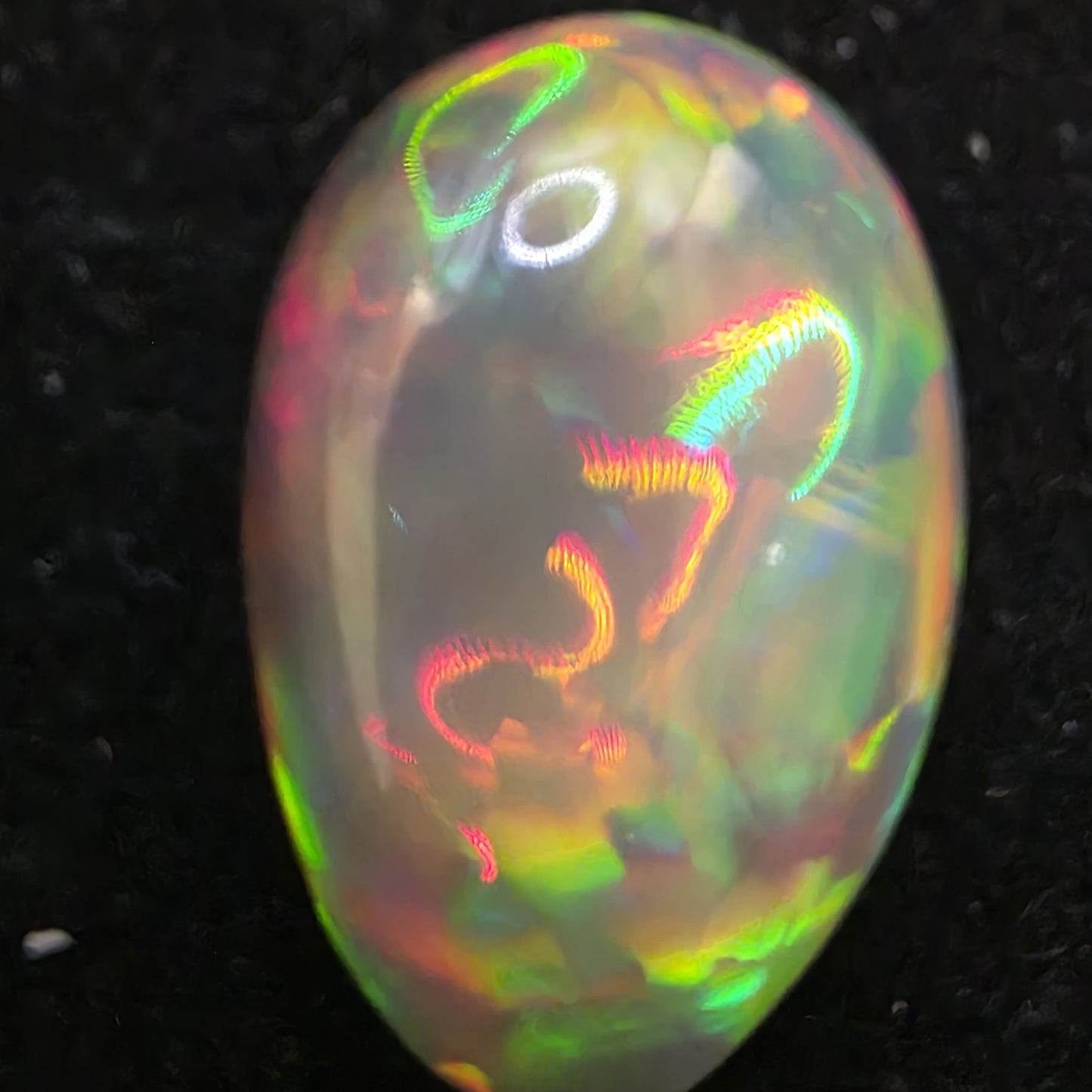 Black Opal special Ethiopian Welo, 9.45 ct pear polished, natural, intense Play-of-Colour