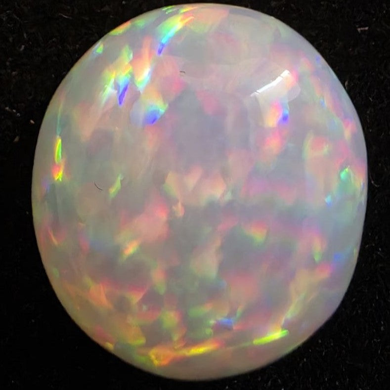 White Opal special Ethiopian Welo, 8.55 ct round polished, natural, intense Play-of-Colour