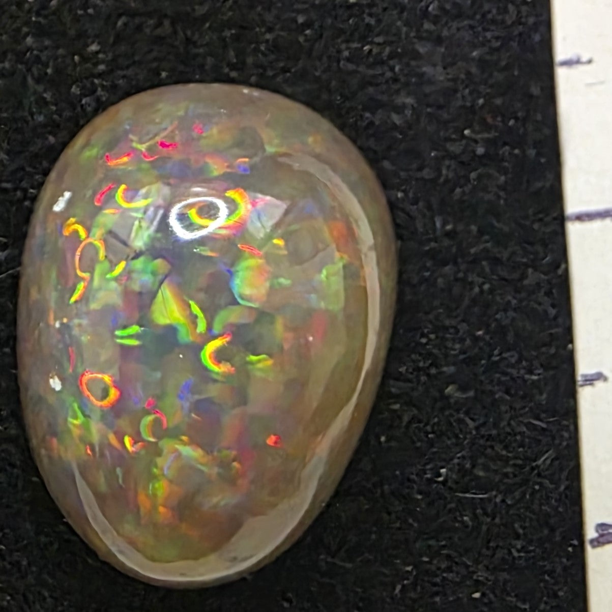 Black Opal special Ethiopian Welo, 7.8 ct pear polished, natural, intense Play-of-Colour