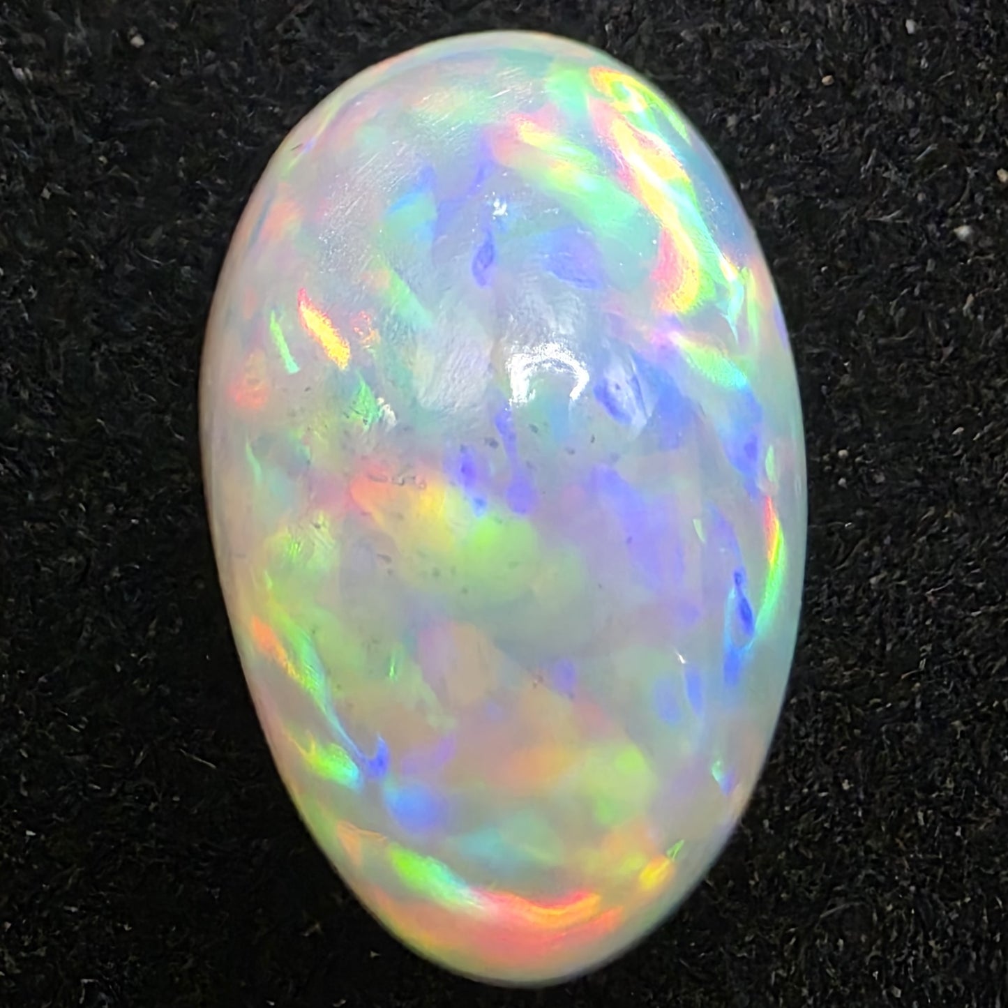 White Opal special Ethiopian Welo, 7.85 ct oval polished, natural, intense Play-of-Colour