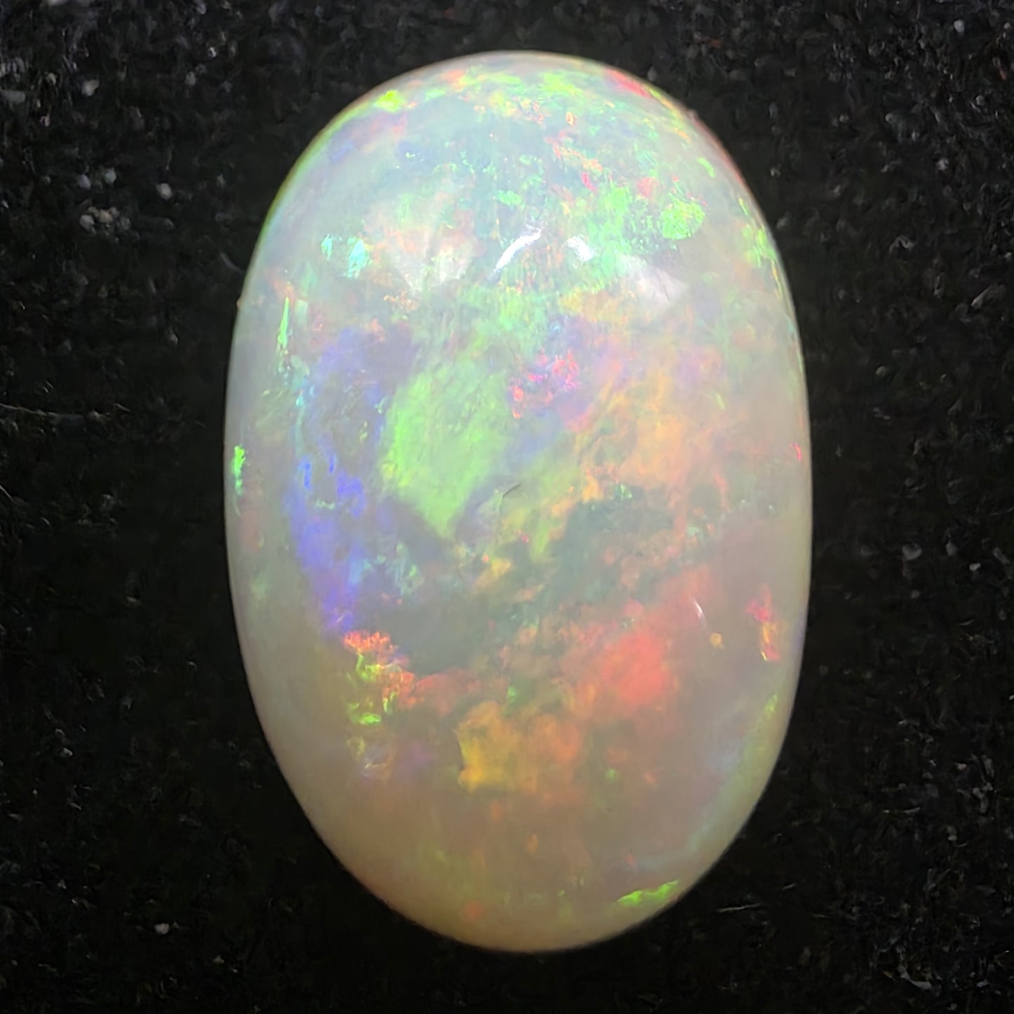 White Opal special Ethiopian Welo, 5.8 ct oval polished, natural, intense Play-of-Colour