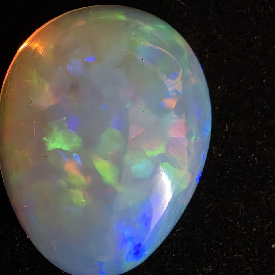 White Opal special Ethiopian Welo, 14.25 ct pear polished, natural, intense Play-of-Colour