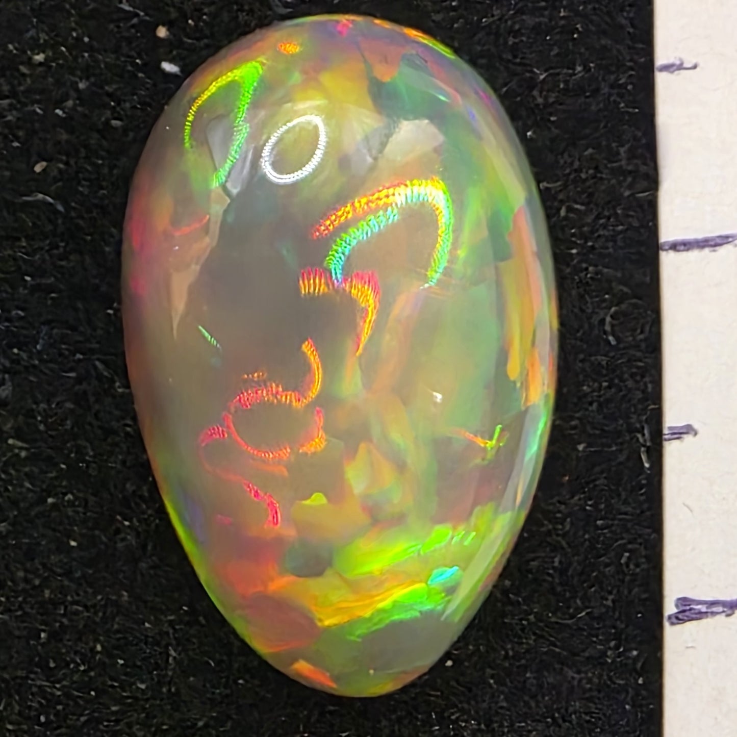 Black Opal special Ethiopian Welo, 9.45 ct pear polished, natural, intense Play-of-Colour