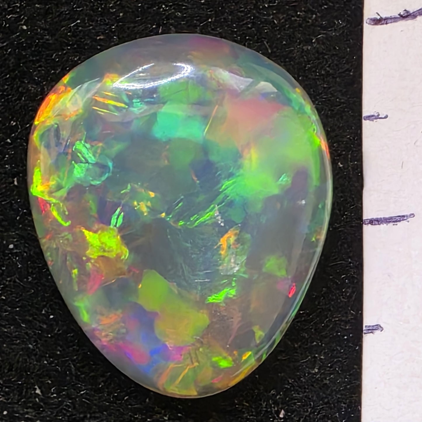 Black Opal special Ethiopian Welo, 6.6 ct pear polished, natural, intense Play-of-Colour
