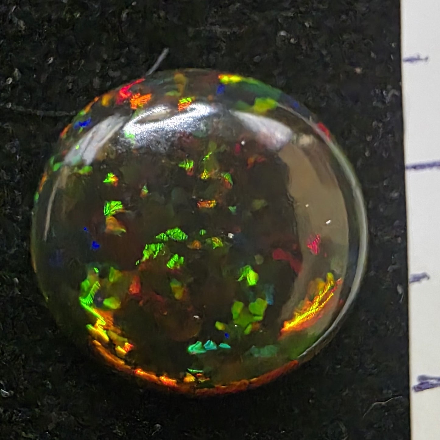 Black Opal special Ethiopian Welo, 6.05 ct oval polished, natural, intense Play-of-Colour