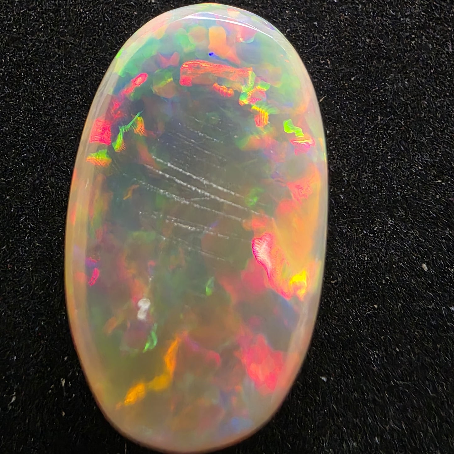 White Opal special Ethiopian Welo, 13.8 ct oval polished, natural, intense Play-of-Colour