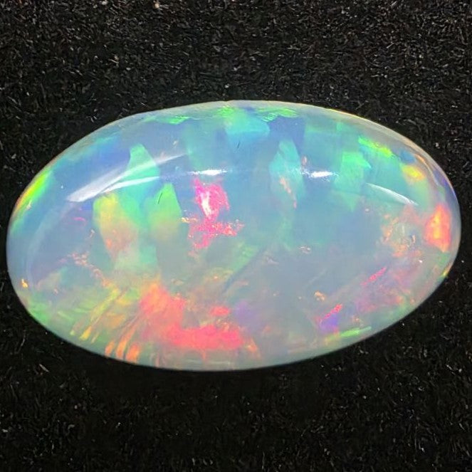 White Opal special Ethiopian Welo, 5.3 ct oval polished, natural, intense Play-of-Colour