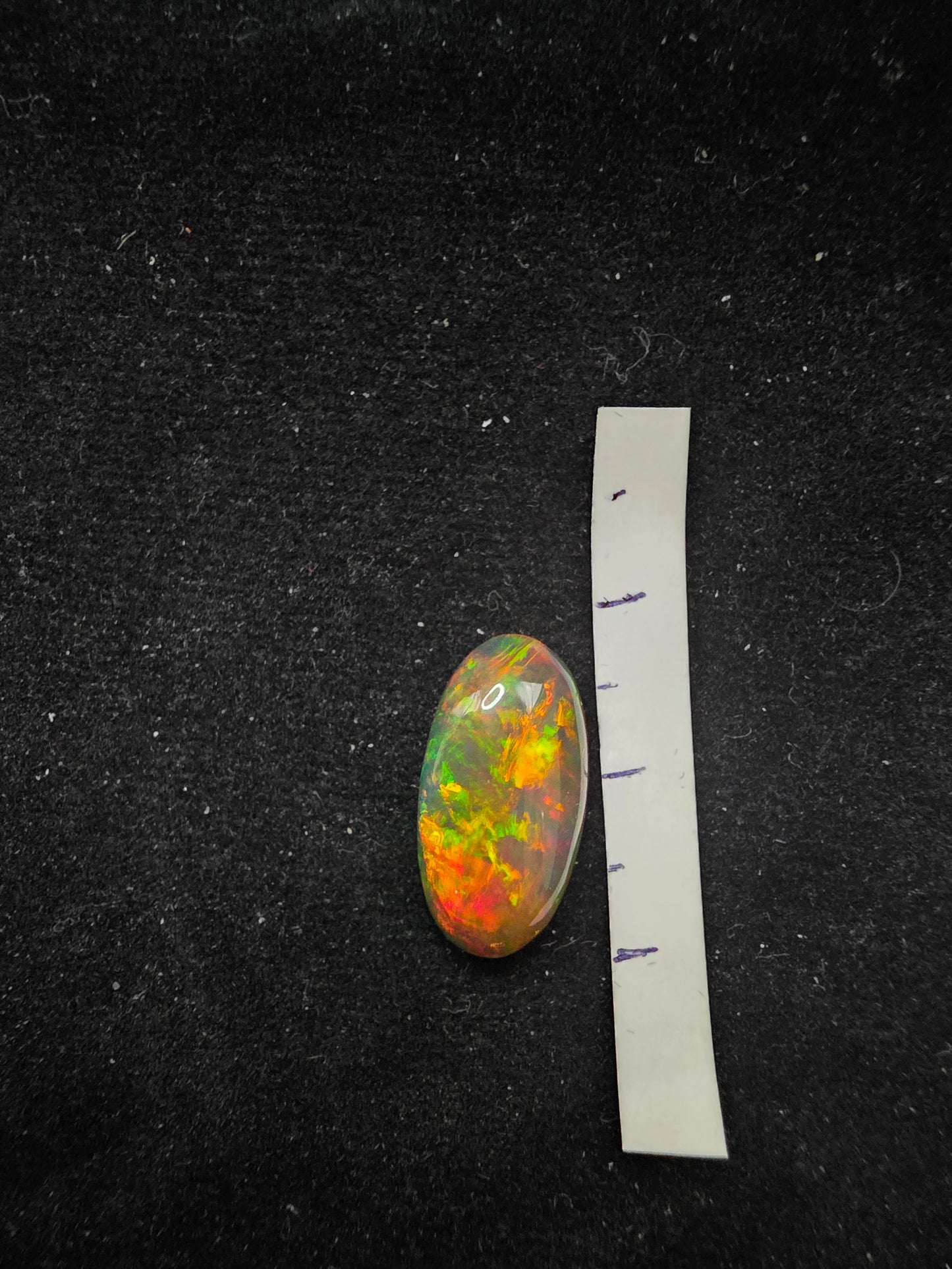 Black Opal special Ethiopian Welo, 4.3 ct oval polished, natural, intense Play-of-Colour