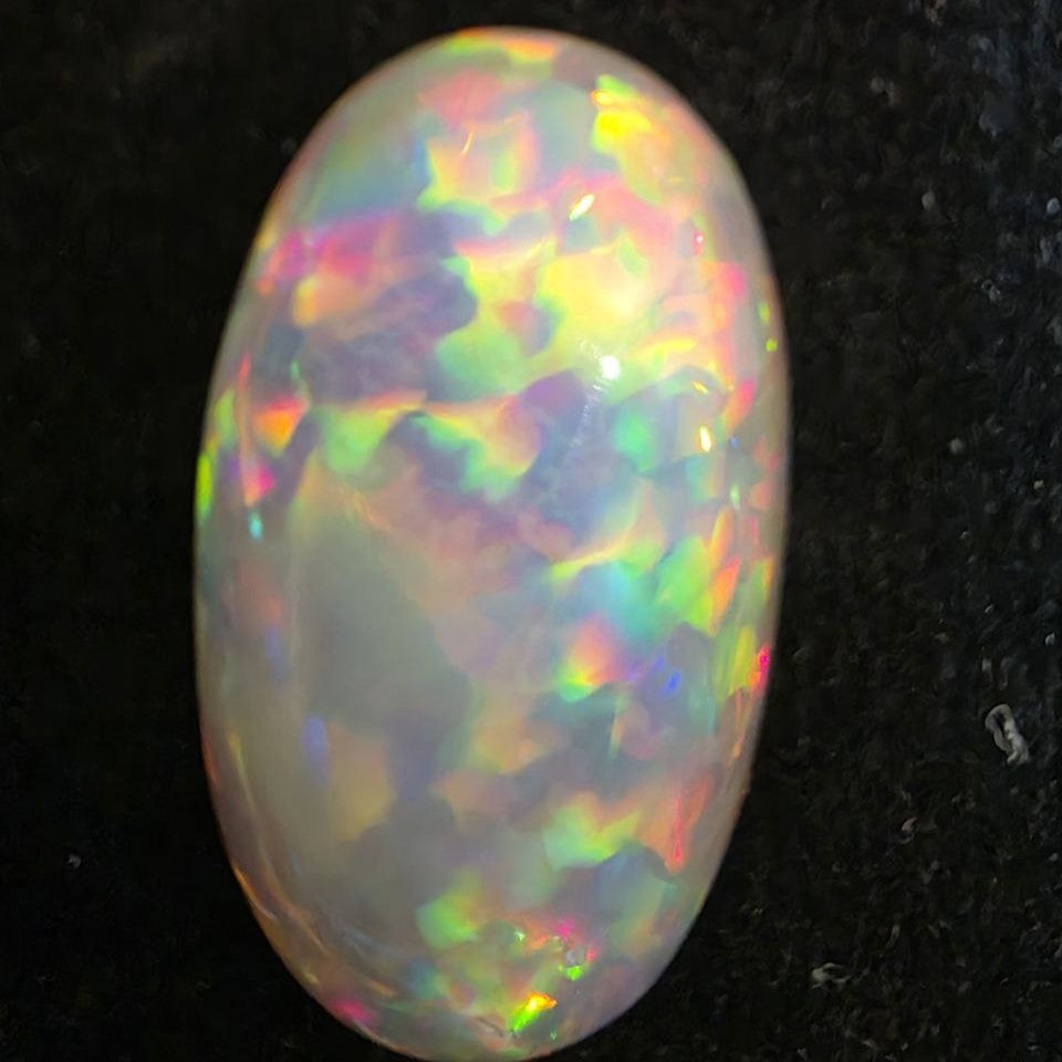 White Opal special Ethiopian Welo, 11.55 ct oval polished, natural, intense Play-of-Colour