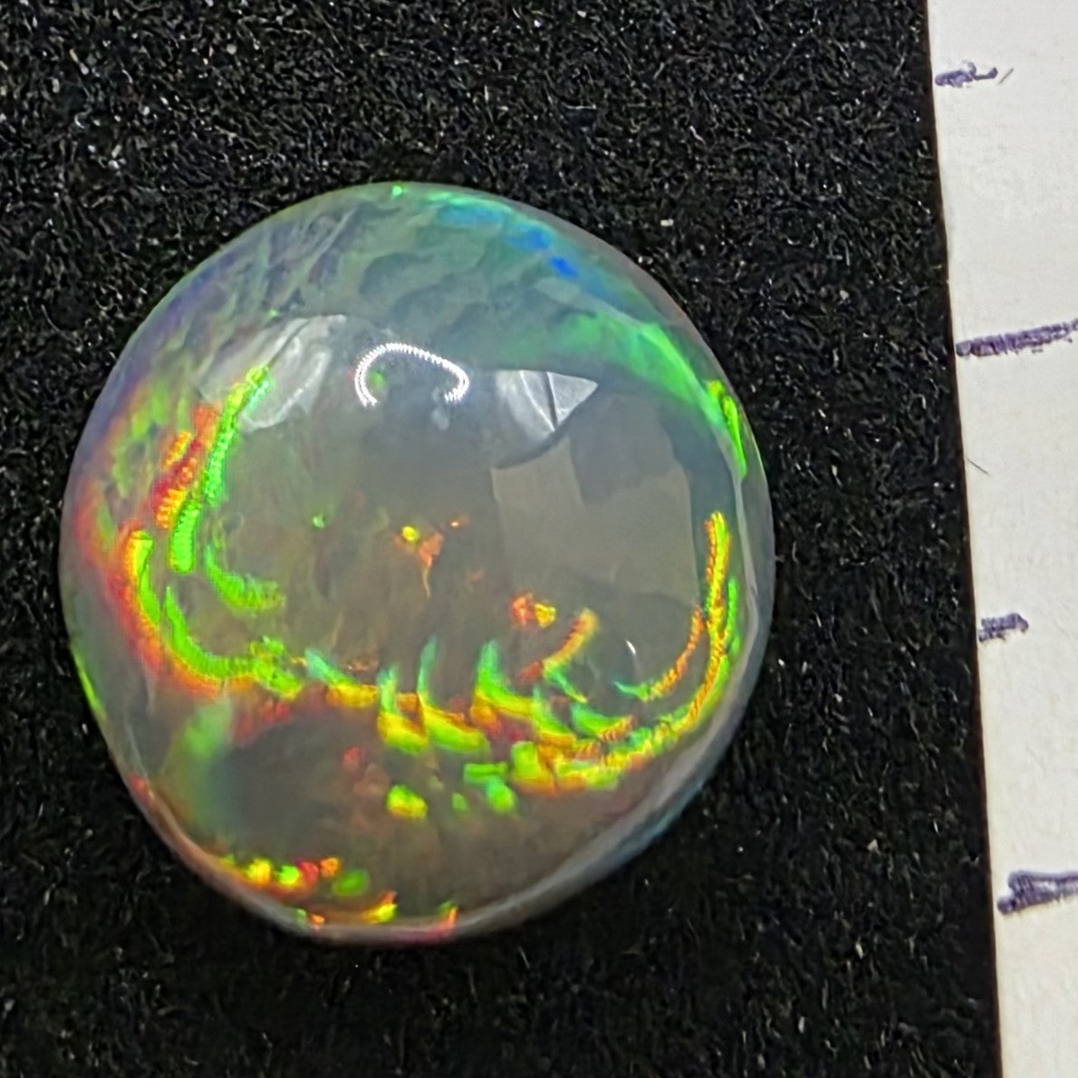 Black Opal special Ethiopian Welo, 5.75 ct round polished, natural, intense Play-of-Colour