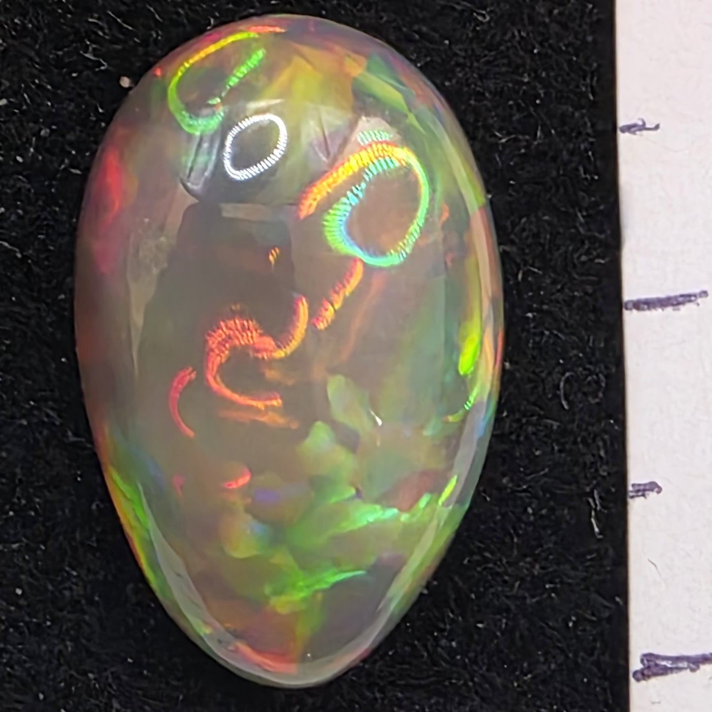Black Opal special Ethiopian Welo, 9.45 ct pear polished, natural, intense Play-of-Colour