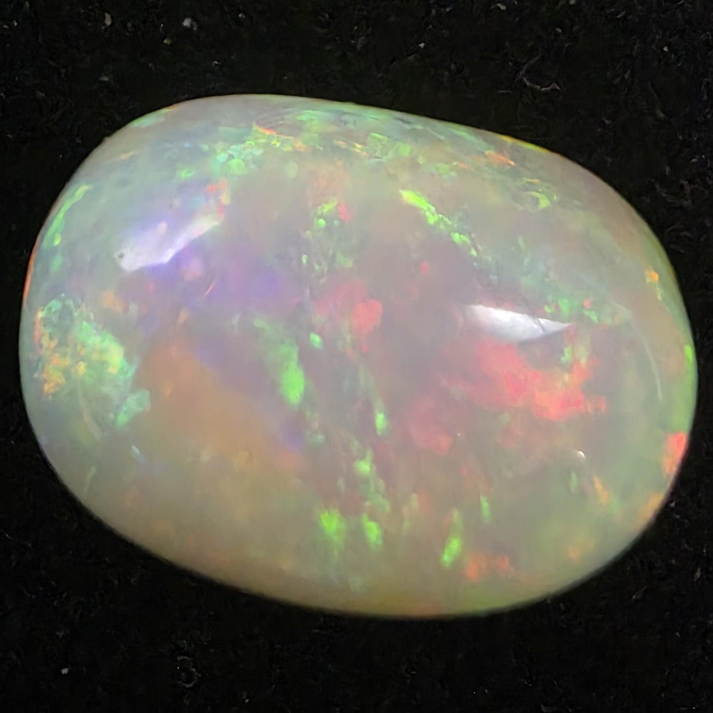 White Opal special Ethiopian Welo, 5.8 ct oval polished, natural, intense Play-of-Colour