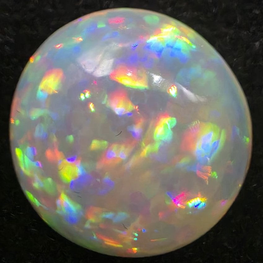 Black Opal special Ethiopian Welo, 5 ct round polished, natural, intense Play-of-Colour