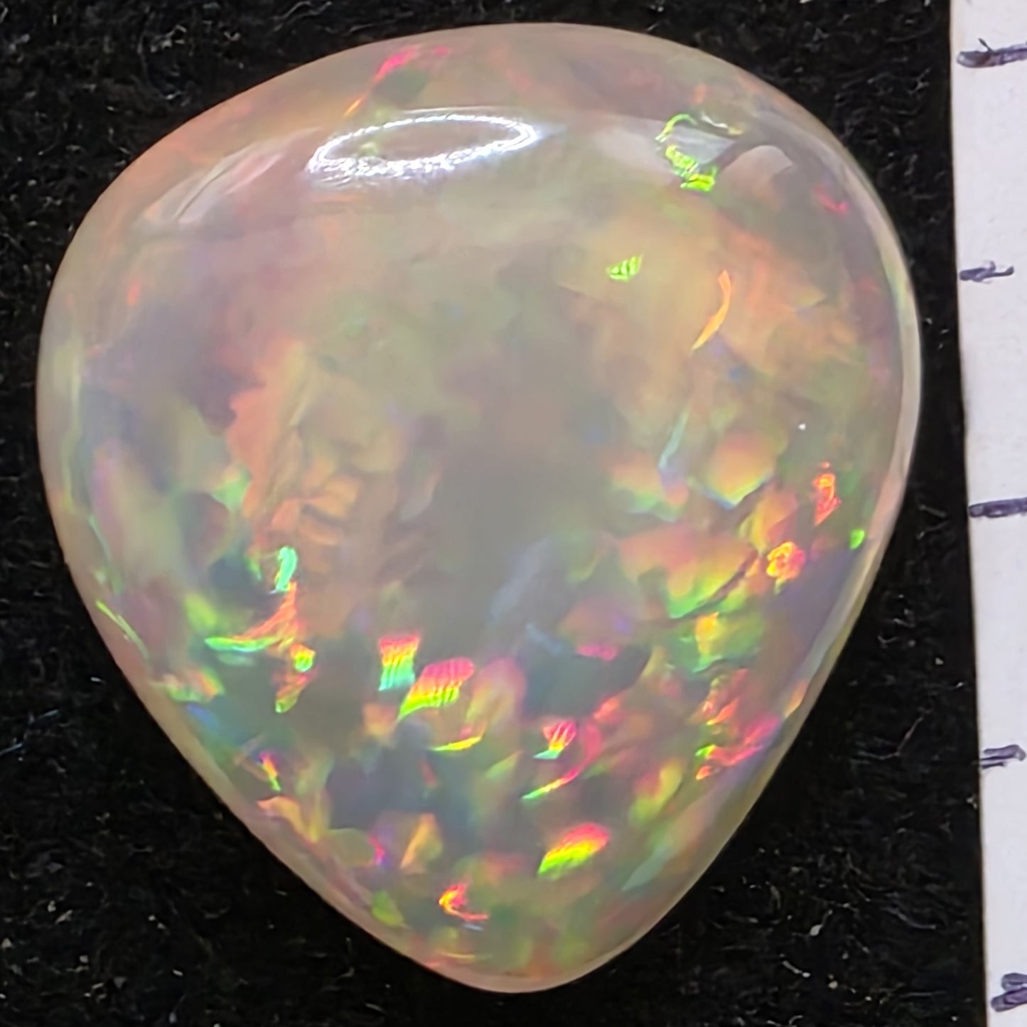 White Opal special Ethiopian Welo, 12.5 ct pear polished, natural, intense Play-of-Colour