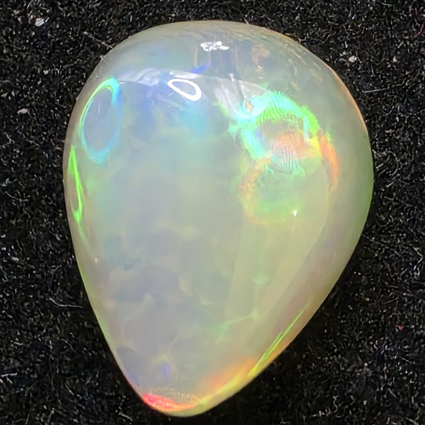 White Opal special Ethiopian Welo, 2.75 ct pear polished, natural, intense Play-of-Colour