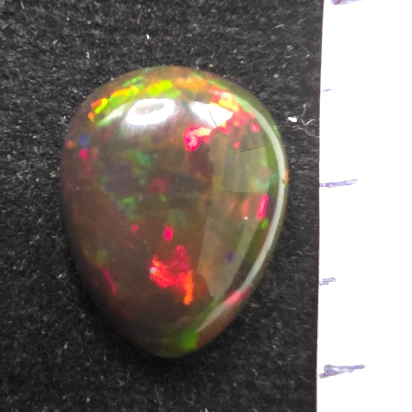 Black Opal special Ethiopian Welo, 4.7 ct pear polished, natural, intense Play-of-Colour