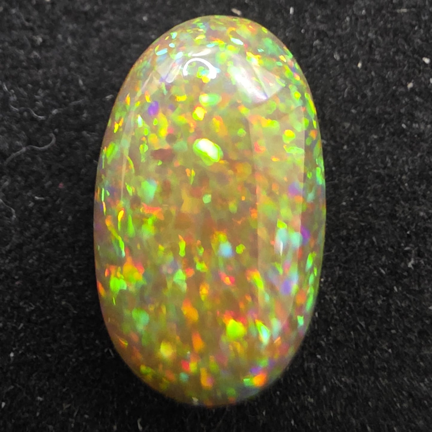 Black Opal special Ethiopian Welo, 4.1 ct oval polished, natural, intense Play-of-Colour