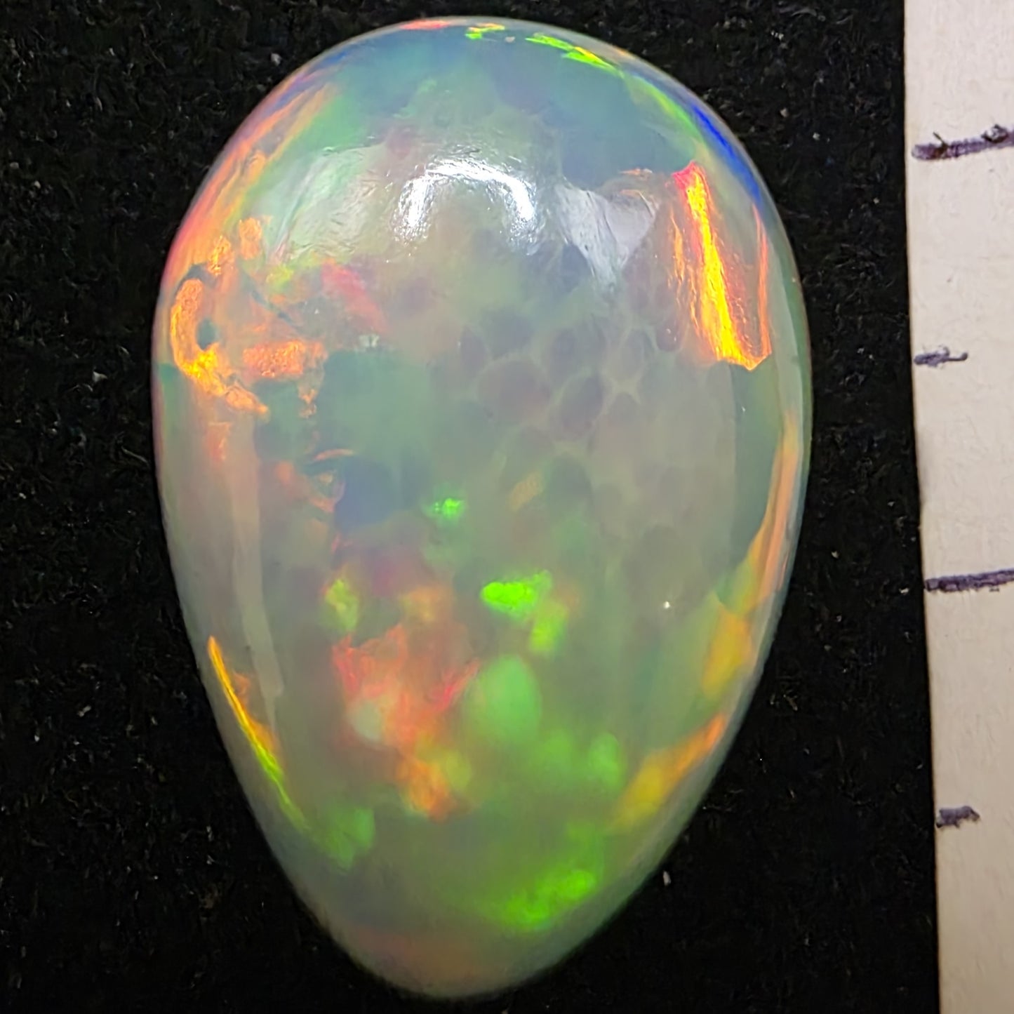 White Opal special Ethiopian Welo, 10.85 ct pear polished, natural, intense Play-of-Colour