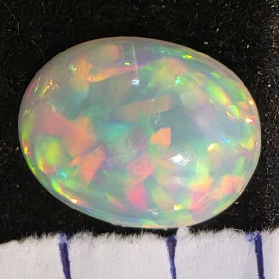 White Opal special Ethiopian Welo, 6.35 ct oval polished, natural, intense Play-of-Colour