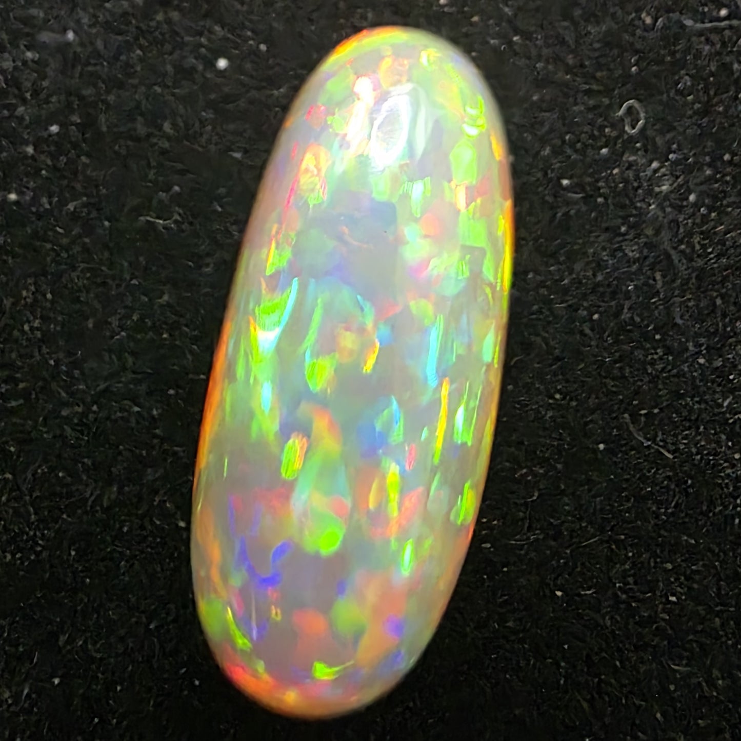 Black Opal special Ethiopian Welo, 6.85 ct oval polished, natural, intense Play-of-Colour