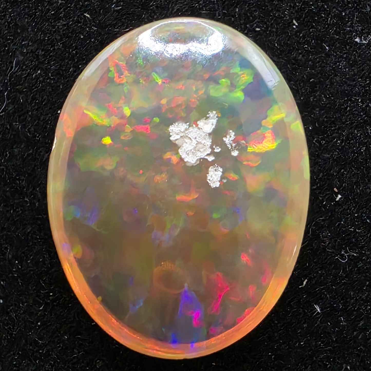 Black Opal special Ethiopian Welo, 7.15 ct oval polished, natural, intense Play-of-Colour