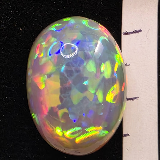 Black Opal special Ethiopian Welo, 14.4 ct oval polished, natural, intense Play-of-Colour