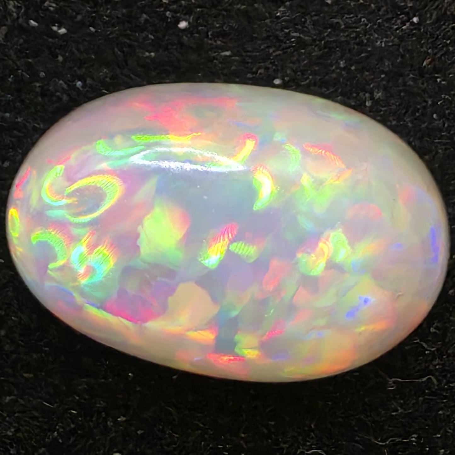 Black Opal special Ethiopian Welo, 6.55 ct oval polished, natural, intense Play-of-Colour