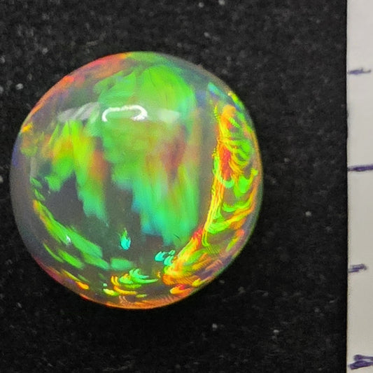 Crystal Opal special Ethiopian Welo, 5.6 ct round polished, natural, intense Play-of-Colour
