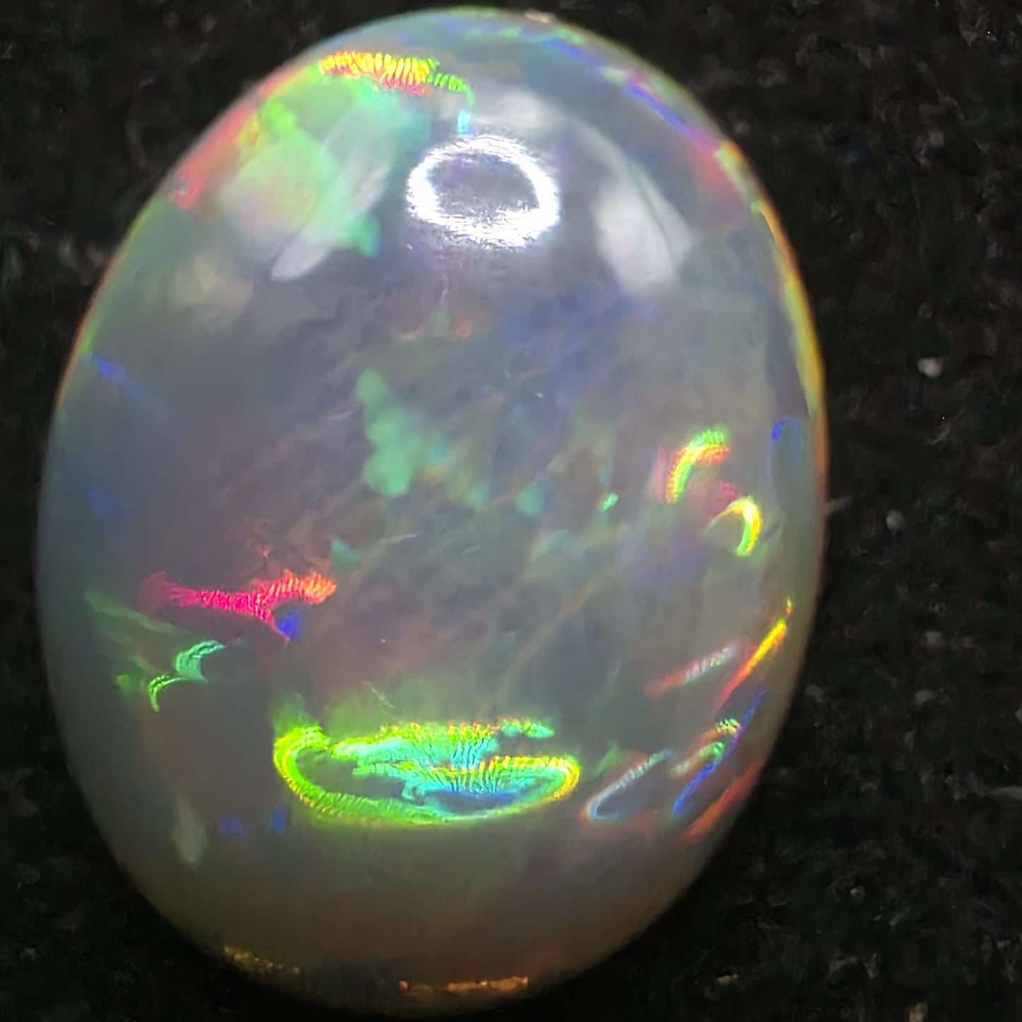 Black Opal special Ethiopian Welo, 7.45 ct oval polished, natural, intense Play-of-Colour