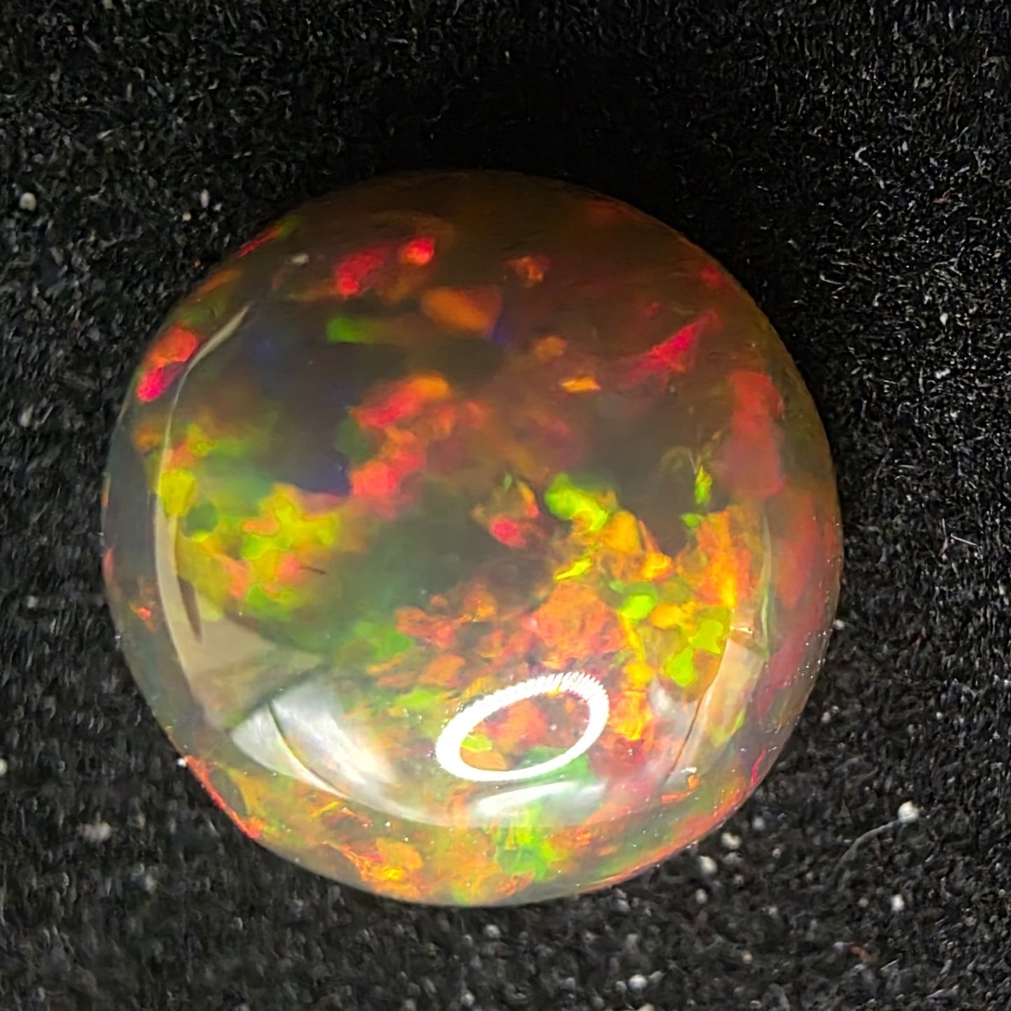 Black Opal special Ethiopian Welo, 4.25 ct round polished, natural, intense Play-of-Colour