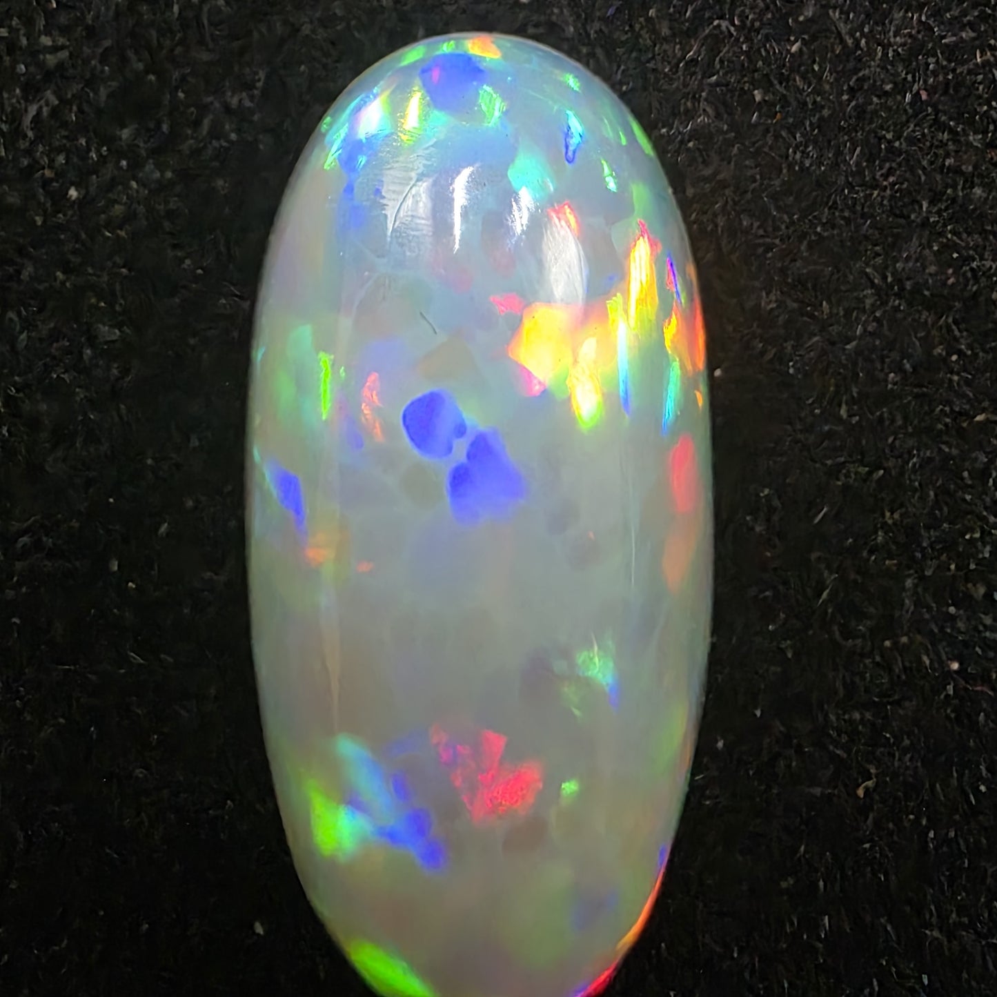 White Opal special Ethiopian Welo, 4.2 ct oval polished, natural, intense Play-of-Colour
