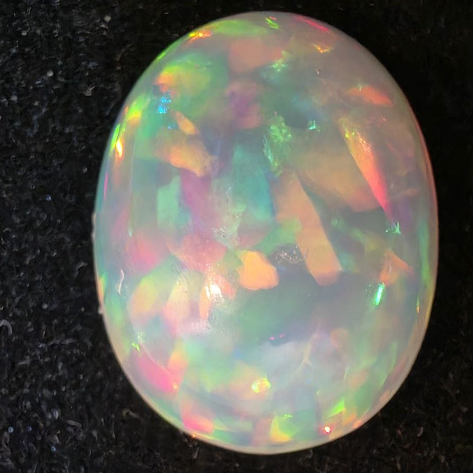 White Opal special Ethiopian Welo, 6.35 ct oval polished, natural, intense Play-of-Colour